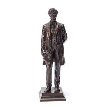 (ABRAHAM LINCOLN.) George E. Bissell, sculptor. Statuette of Lincoln standing with the Emancipation Proclamation.